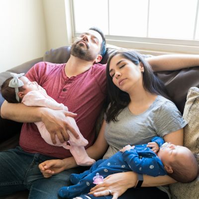 mum dad and twins napping together