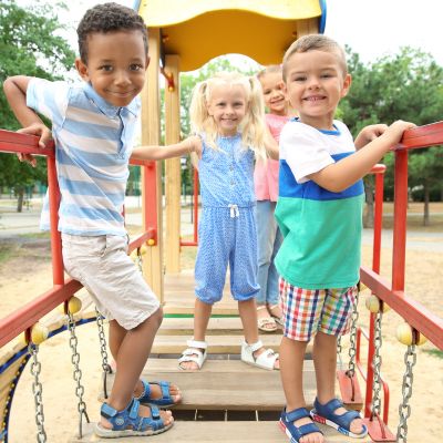 3 children on a climbing frame