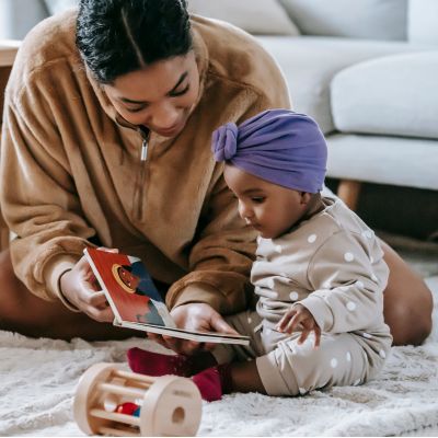 mother and child reading a book together