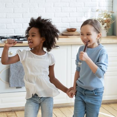 2 children having fun in the kitchen