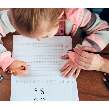 Child learning to form letters