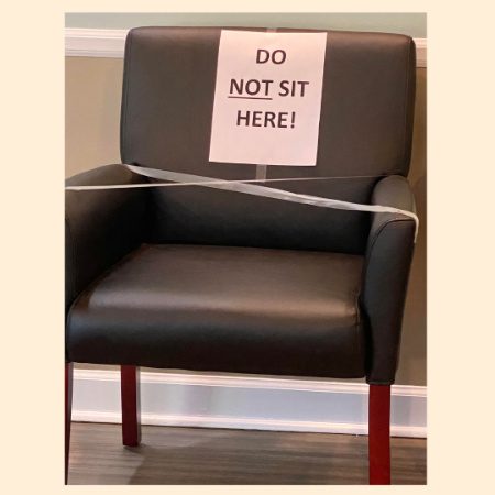 Chair with sign: do not sit here